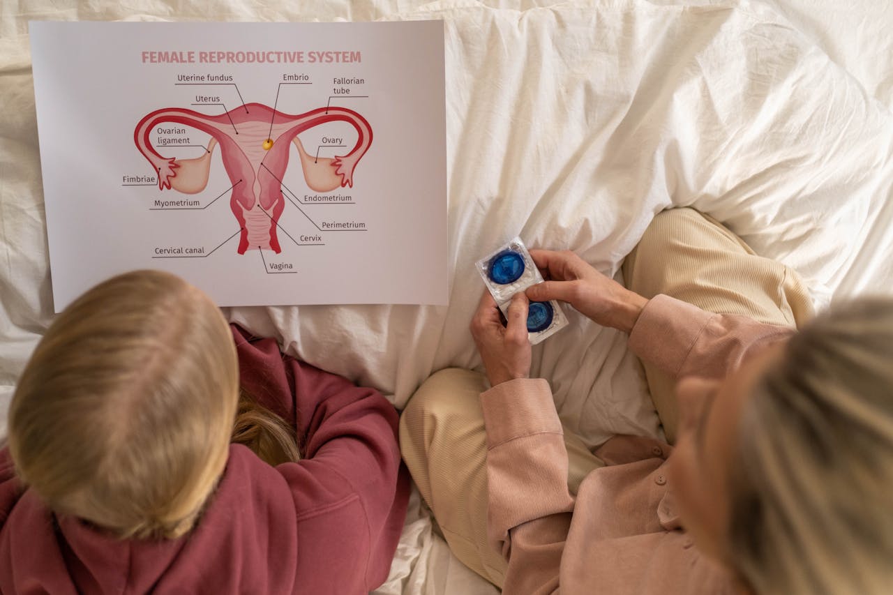 embark A mother and daughter learning about female reproductive health and contraception.